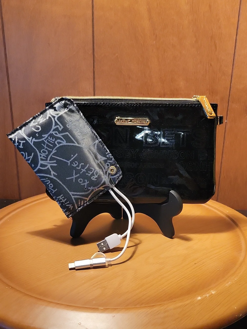 Betsey Johnson Black Patent Wristlet with Gold Accents and Cell Phone Charger